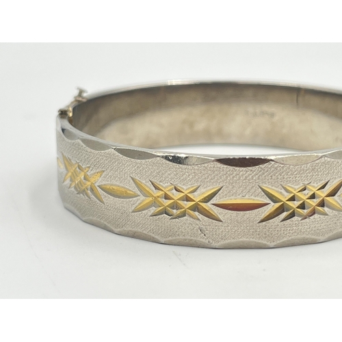 2401A - An 18ct gold plated etched bangle