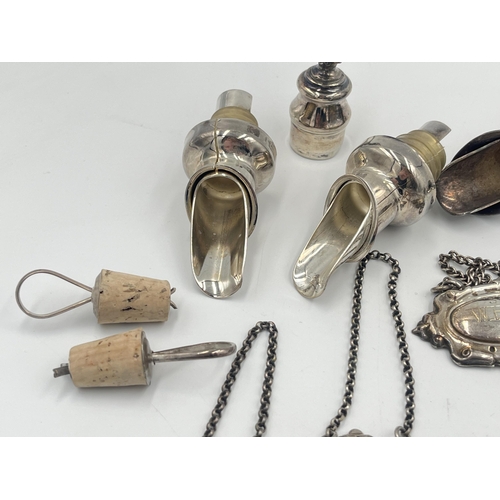 2544 - A collection of white metal and silver plated breweriana items to include decanter labels, bottle st... 