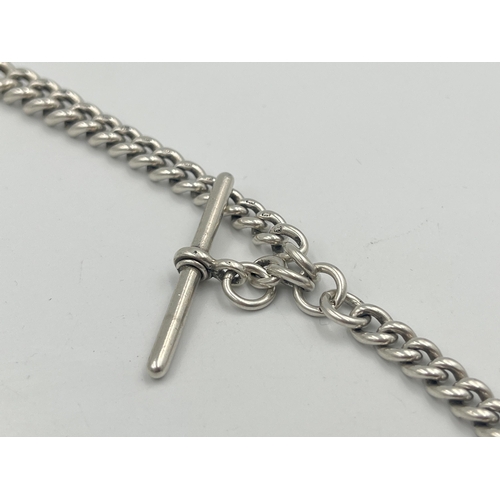 2550 - An Edwardian Herbert Bushell hallmarked Birmingham silver albert chain with T bar and three fobs, da... 