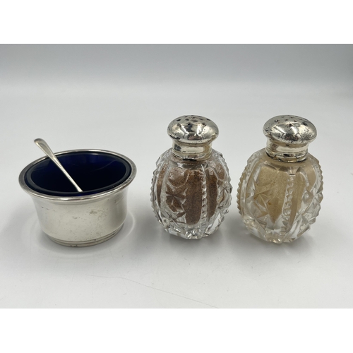 2553 - Three items, one hallmarked Birmingham silver condiment pot with spoon and two cut glass pepper shak... 