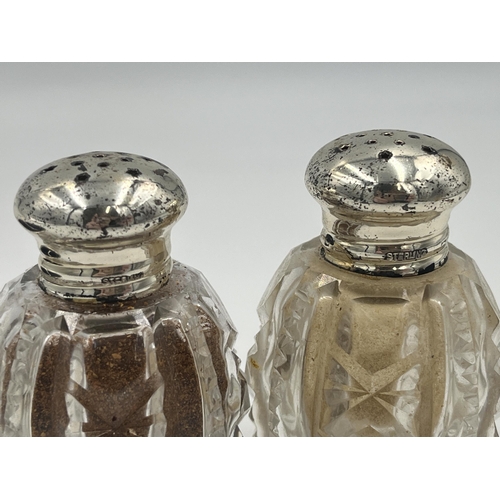 2553 - Three items, one hallmarked Birmingham silver condiment pot with spoon and two cut glass pepper shak... 