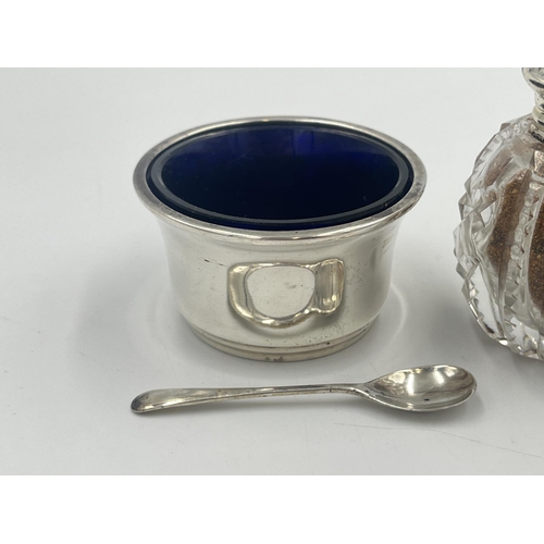 2553 - Three items, one hallmarked Birmingham silver condiment pot with spoon and two cut glass pepper shak... 