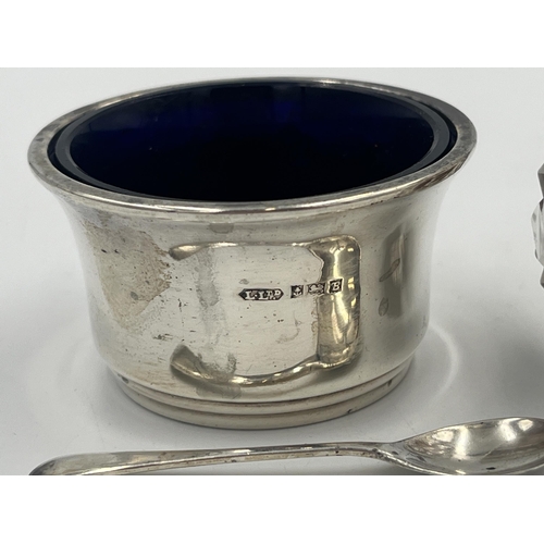 2553 - Three items, one hallmarked Birmingham silver condiment pot with spoon and two cut glass pepper shak... 