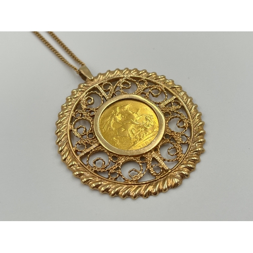 An 1887 Queen Victoria 22ct gold full sovereign with 9ct gold mount and yellow metal chain - approx. gross weight of mount and sovereign 22.8g and approx. weight of chain 5.8g