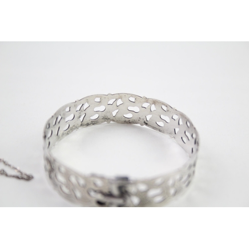 2023 - Two hallmarked sterling silver cutwork bangles - approx. gross weight 31g