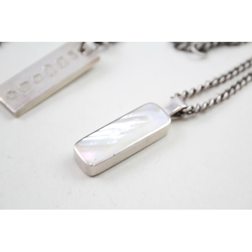 2034 - Two hallmarked sterling silver pendant necklaces, one mother of pearl and one ingot - approx. gross ... 