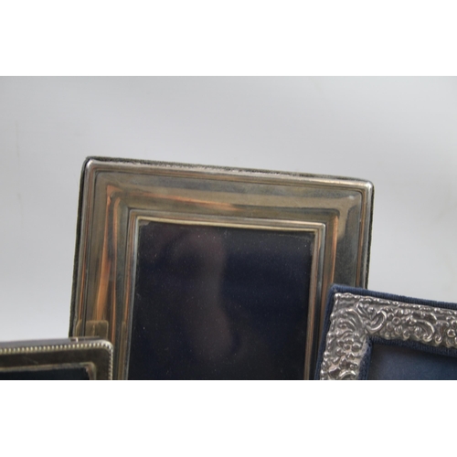 2132 - Three .925 sterling silver photograph frames - largest approx. 14cm x 18cm