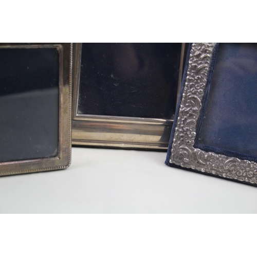 2132 - Three .925 sterling silver photograph frames - largest approx. 14cm x 18cm