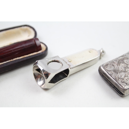 2158 - Four sterling silver tobacciana items, two vesta cases, cigar cutter etc. - approx. gross weight 72g