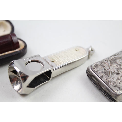 2158 - Four sterling silver tobacciana items, two vesta cases, cigar cutter etc. - approx. gross weight 72g