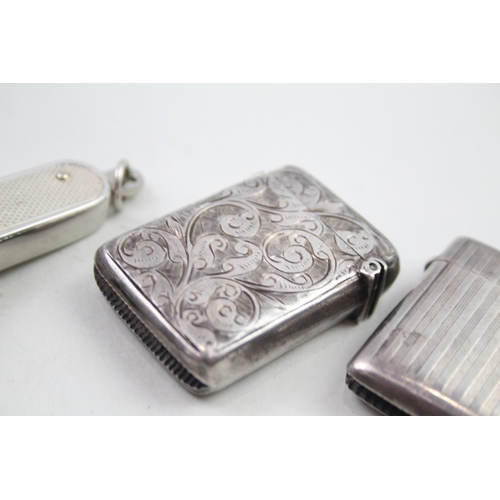 2158 - Four sterling silver tobacciana items, two vesta cases, cigar cutter etc. - approx. gross weight 72g