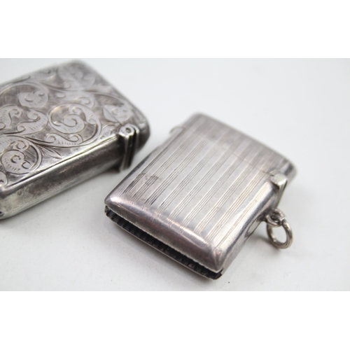 2158 - Four sterling silver tobacciana items, two vesta cases, cigar cutter etc. - approx. gross weight 72g