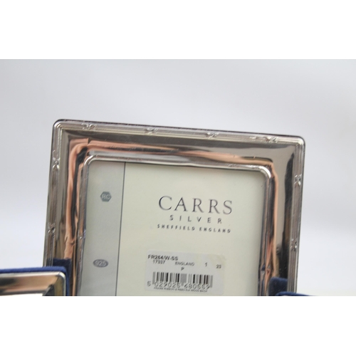 2169 - Three Carrs of Sheffield .925 sterling silver photograph frames - largest approx. 14cm x 19cm