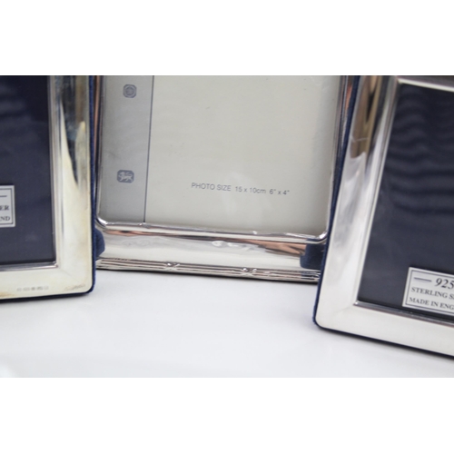 2169 - Three Carrs of Sheffield .925 sterling silver photograph frames - largest approx. 14cm x 19cm