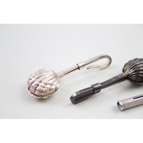 2175 - Four .925 sterling silver items, two napkin clips and two toothpicks - approx. gross weight 30g