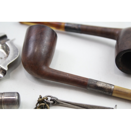 2177 - Five .925 sterling silver tobacciana items to include two sterling silver collared smoking pipes, as... 