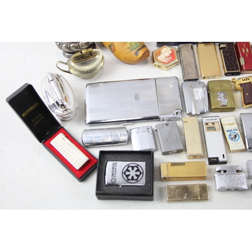 500 - A large collection of cigarette lighters to include table lighters, novelty lighters etc.