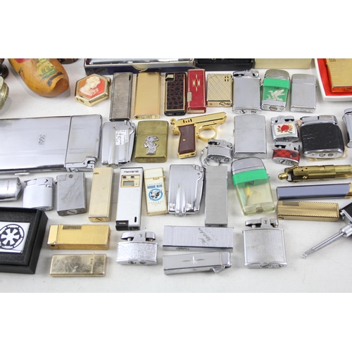 500 - A large collection of cigarette lighters to include table lighters, novelty lighters etc.