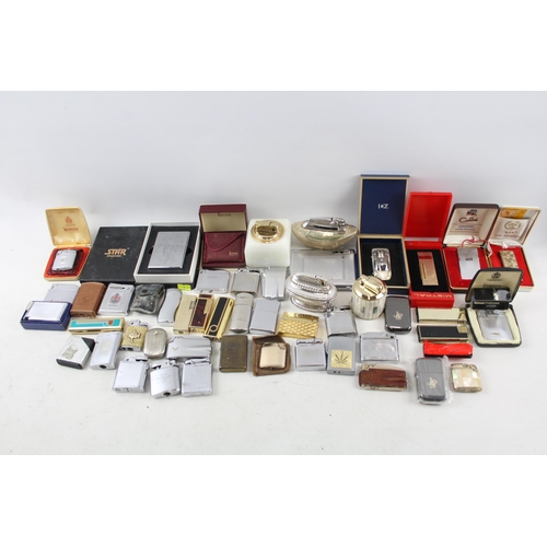 501 - A large collection of lighters to include Ronson, Rolstar, Colibri, Zippo etc.