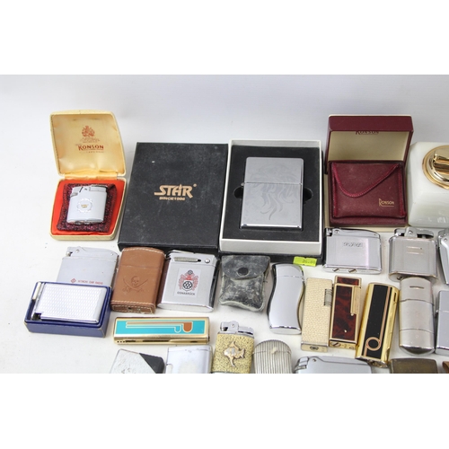 501 - A large collection of lighters to include Ronson, Rolstar, Colibri, Zippo etc.