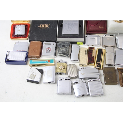 501 - A large collection of lighters to include Ronson, Rolstar, Colibri, Zippo etc.