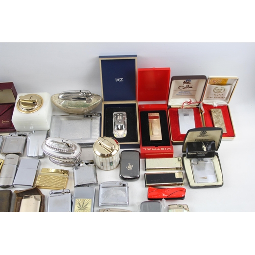 501 - A large collection of lighters to include Ronson, Rolstar, Colibri, Zippo etc.