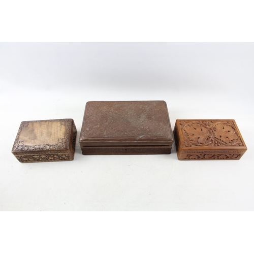 505 - Three Indian carved teak jewellery boxes - largest approx. 8cm high x 29cm wide x 19cm deep