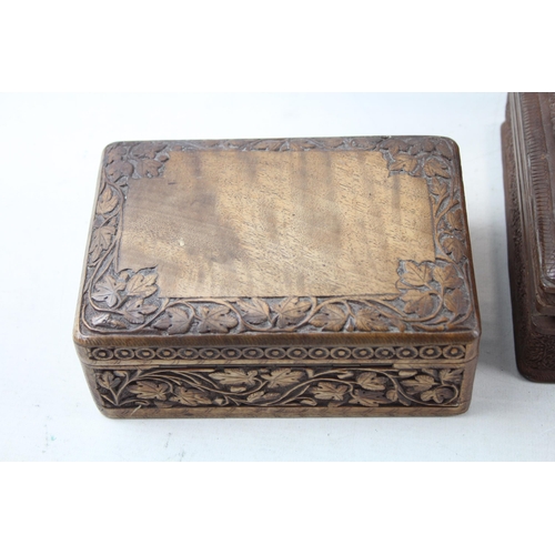 505 - Three Indian carved teak jewellery boxes - largest approx. 8cm high x 29cm wide x 19cm deep