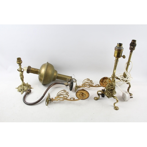 513 - Seven pieces of antique and later brass lighting to include S. M. Gas Co wall light, two Pullman tri... 