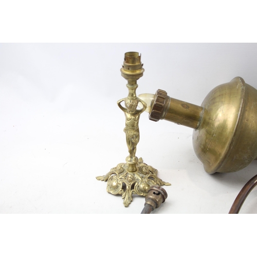 513 - Seven pieces of antique and later brass lighting to include S. M. Gas Co wall light, two Pullman tri... 