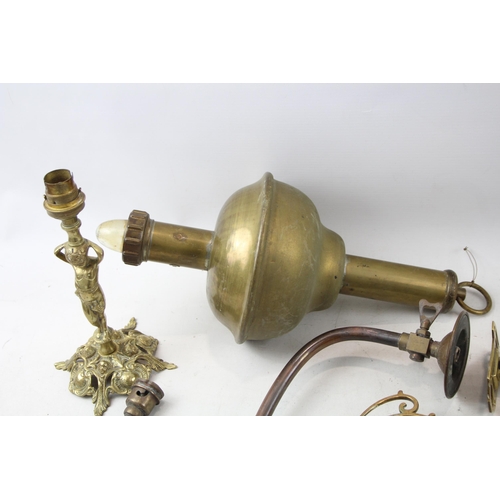 513 - Seven pieces of antique and later brass lighting to include S. M. Gas Co wall light, two Pullman tri... 