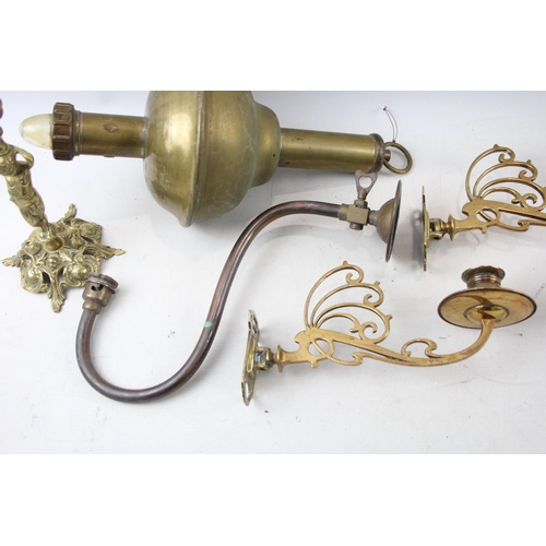 513 - Seven pieces of antique and later brass lighting to include S. M. Gas Co wall light, two Pullman tri... 