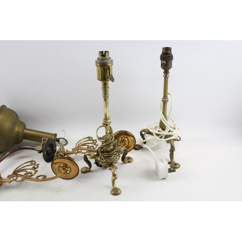 513 - Seven pieces of antique and later brass lighting to include S. M. Gas Co wall light, two Pullman tri... 