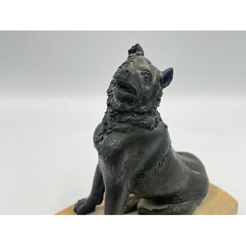 2108 - A cast metal dog figurine on marble plinth - approx. 14cm high