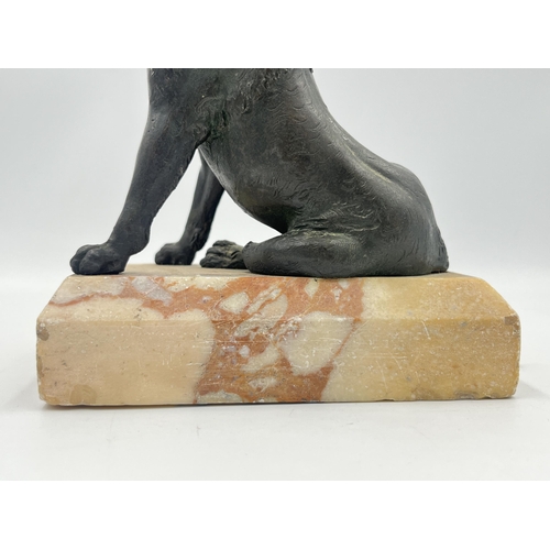 2108 - A cast metal dog figurine on marble plinth - approx. 14cm high