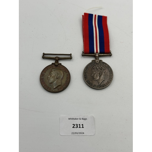 2311 - Two George VI medals, one WWII War and one For Faithful service In The Special Constabulary presente... 