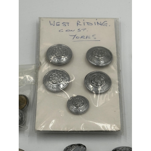 2328 - A collection of British uniform buttons to include Manchester Police, Birmingham, West Riding etc.