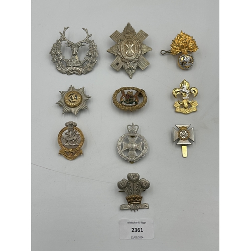 2361 - A collection of military cap badges