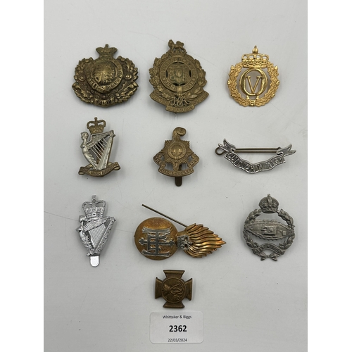 2362 - A collection of military cap badges