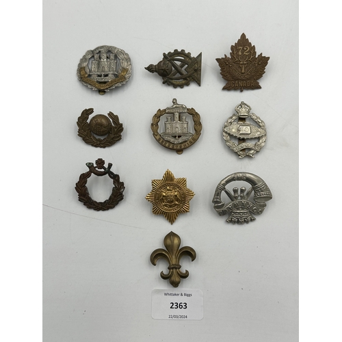 2363 - A collection of military cap badges