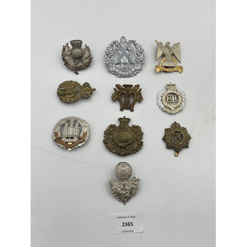 2365 - A collection of military cap badges