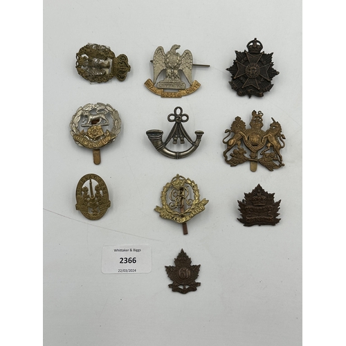 2366 - A collection of military cap badges