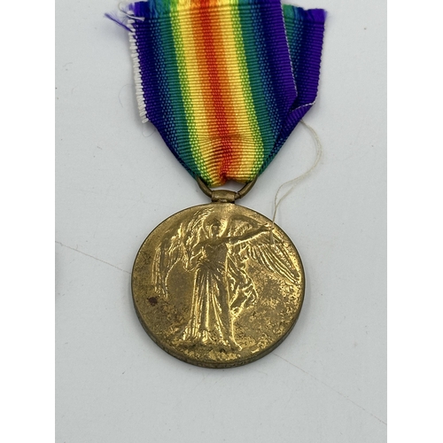 2374 - Three medals, one WWI medal pair comprising unnamed 1914-15 star and Victory presented to 30957 Pte.... 