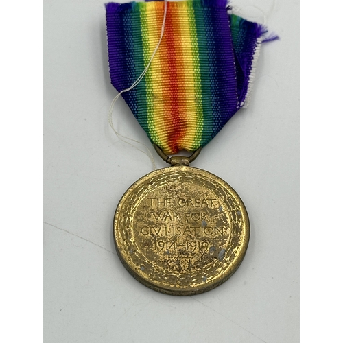 2374 - Three medals, one WWI medal pair comprising unnamed 1914-15 star and Victory presented to 30957 Pte.... 