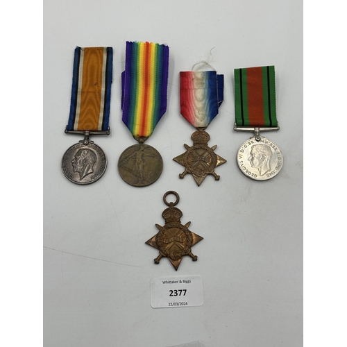 2377 - Five medals to include WWI Belgian Victory, British 1939-1945 Defence, two 1914-15 stars presented t... 