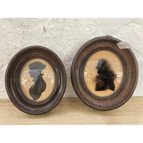 256 - Four 19th century framed silhouettes - largest approx. 19cm high x 16cm diameter