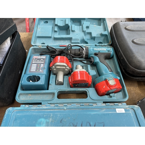 912 - Two cased Makita drills, one 8280D cordless combi drill and one 8406 corded masonry drill