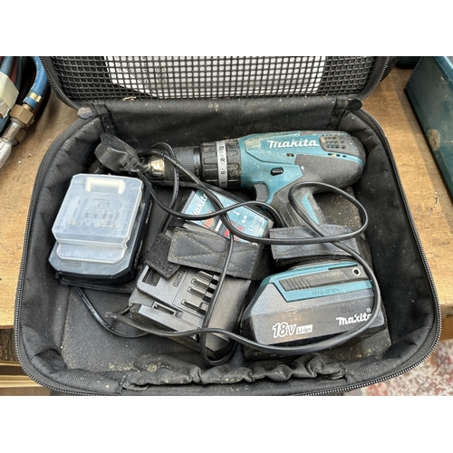 914 - A cased Makita HP457D cordless combi drill