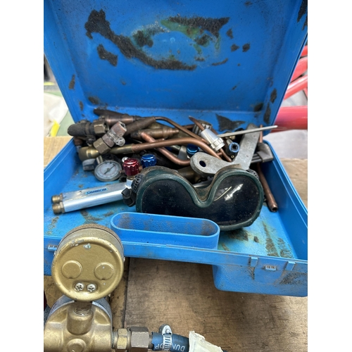 915 - Three items, two welding hoses and one box of welding accessories