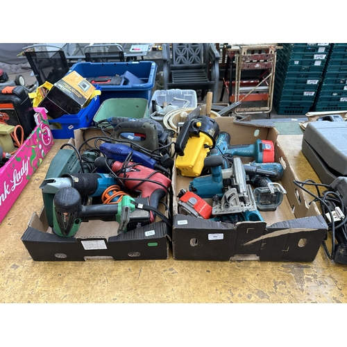 920 - Two boxes of power tools to include Makita 8391D cordless drill, Makita BSS610 cordless circular saw... 